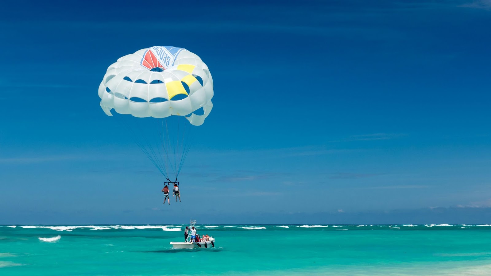 December in Punta Cana is ideal for water sports like parasailing