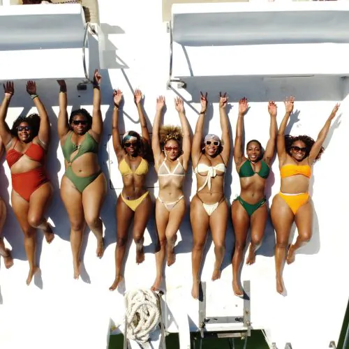 10 - Happy guests taking sunbath and having a lot of fun on our shared catamaran tour in punta cana