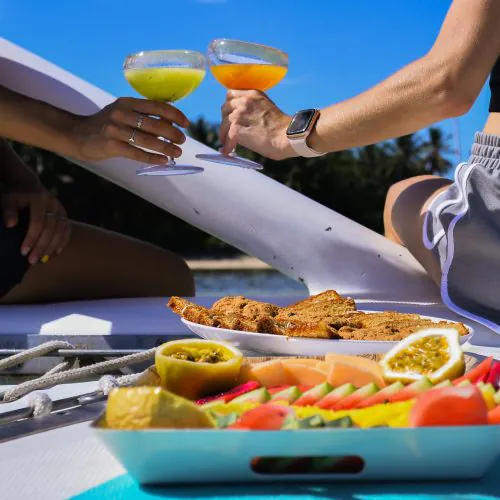 11 - Happy guests enjoying delicious BBQ and drinks on our private catamaran Delux Punta Cana tour