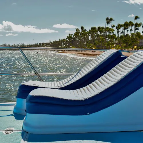13 - Happy guests taking sunbath and enjoy the views of Punta Cana on our private catamaran Delux for large groups tour-min