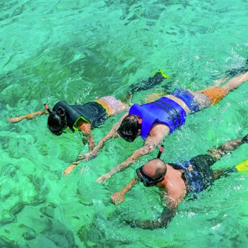14 - Happy guests enjoy snorkeling on our private catamaran Delux Punta Cana tour