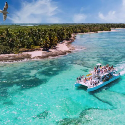 2 - Happy guests enjoying beautiful Punta Cana views on our private catamaran Delux for large groups tour_-min