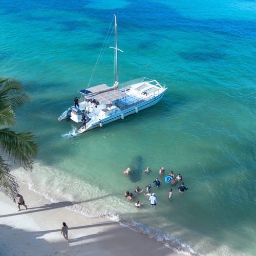 3 - Guest enjoy on beach while snorkeling also on our private catamaran Delux Punta Cana tour