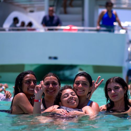 3 - Happy guest enjoy snorkeling in crystal Punta Cana waters on our catamaran Punta Cana isla saona tour
