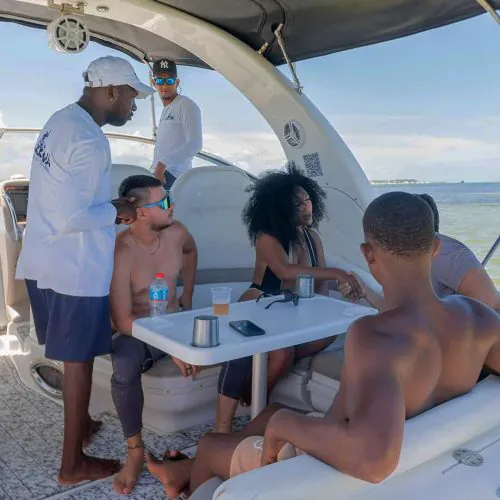 3 - Happy guest seeing beautiful views of Punta Cana on our private yacht Bavaro Punta Cana tour