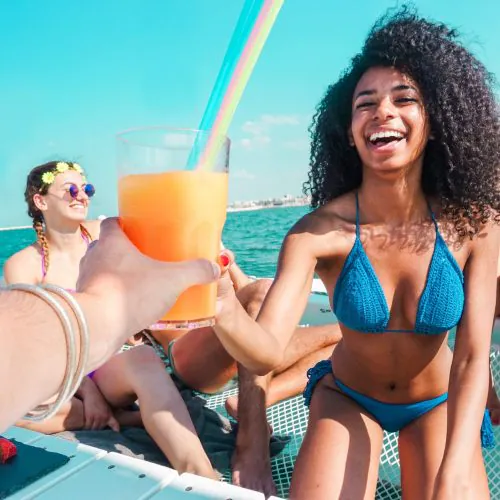 5 - Happy guest enjoy drinks and juices on our private catamaran Delux Punta Cana tour