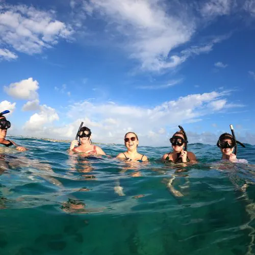8 - Happy guests enjoy snorkeling on our private catamaran Delux for large groups tour-min