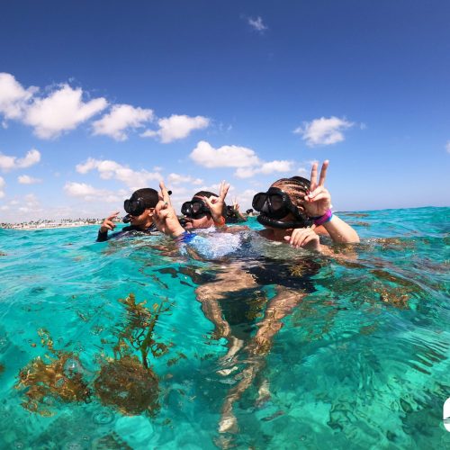 8 - Happy guests snorkeling and having fun on our shared catamaran tour in punta cana