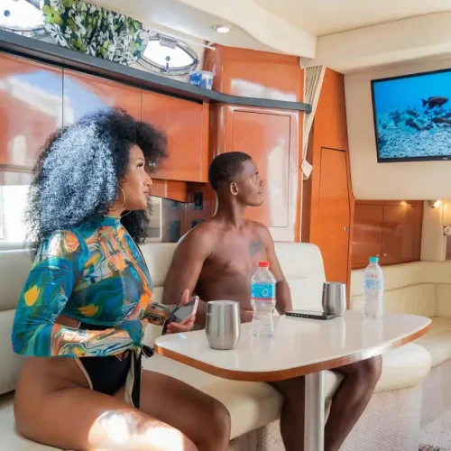 Happy clients watching movie on Yacht Trips Bavaro